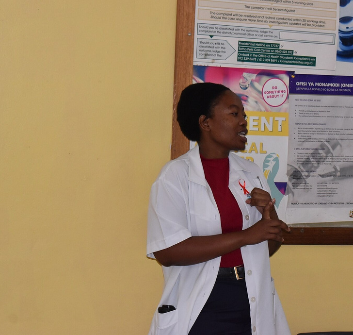 Illustrative photo: a community health worker at a clinic in South Africa on World AIDS Day
