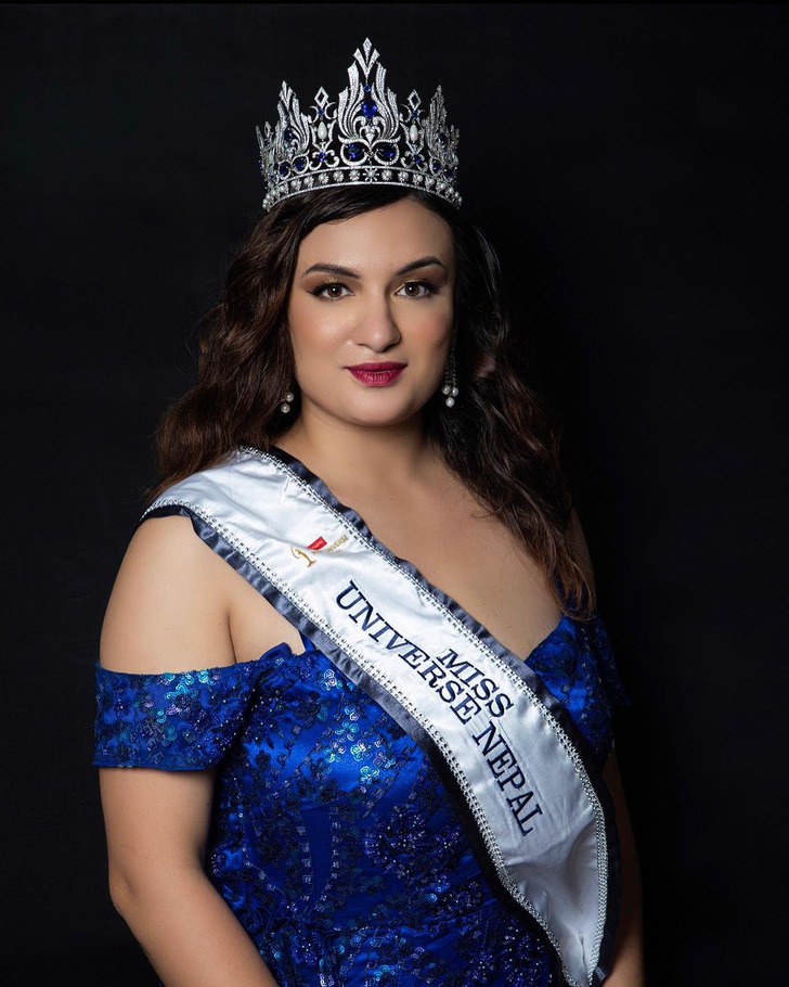 A oversize model wearing Miss Universe Nepal band and drown.