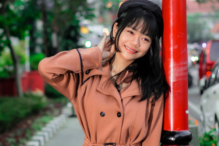 A belted trench coat