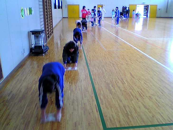 Pupils wipe the gym floor, Japan