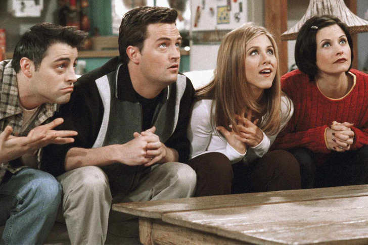 Joey, Chandler, Rachel and Monica sitting on the couch looking up.