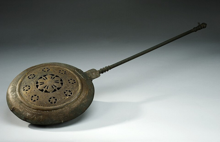 A brass warming pan, Europe, 19th century