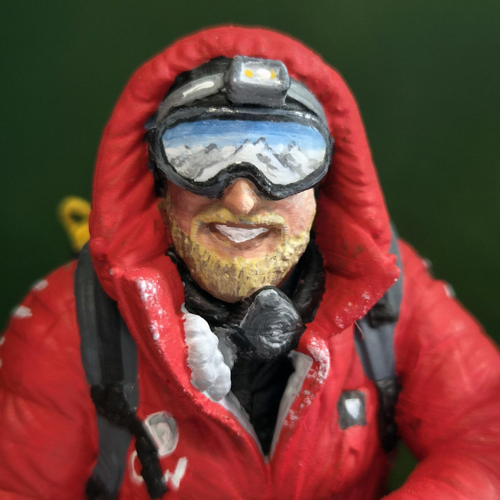 The goggles of the Everest miniature, with the summit view painted in