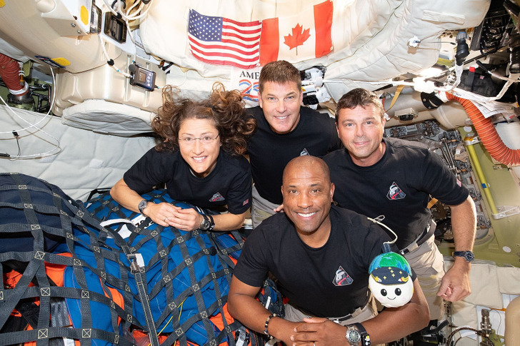 The Artemis II crew with Rise inside Orion, April 7, 2026