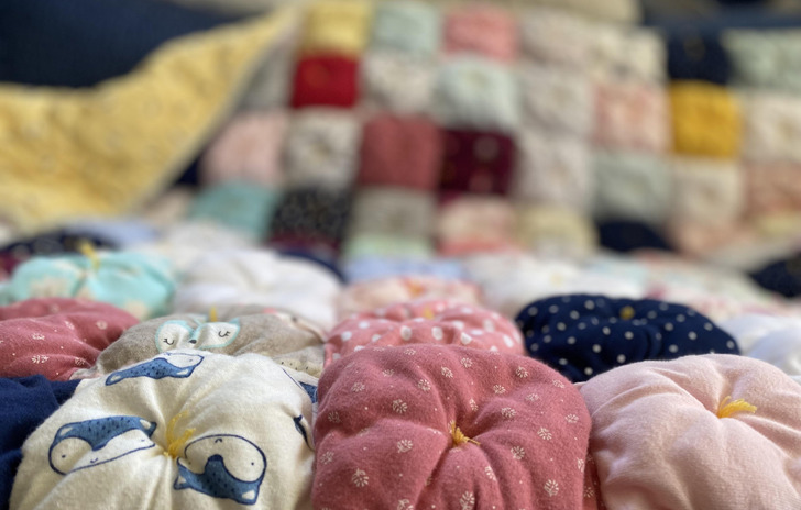 A Parent Made a Puff Quilt From the Baby’s Onesies to Snuggle During the “I Hate You” Stage