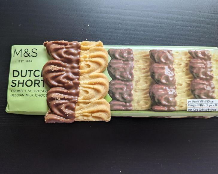 A crumbly shortcake with belgian milk chocolate on top of its package.