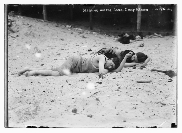 Sleeping on the sand, Coney Island, early 1900s