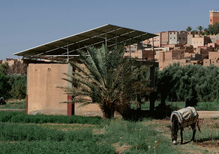 Illustrative photo: solar panels shade a yard in a small town near Marrakech, Morocco