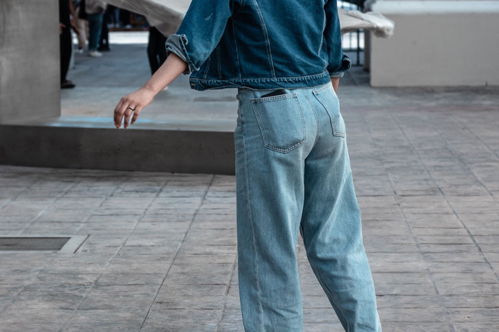A denim jacket with jeans