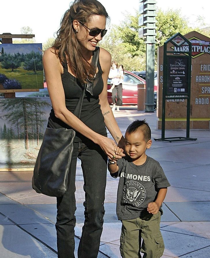 Angelina Jolie has son Maddox by her side as she leaves Washington DC