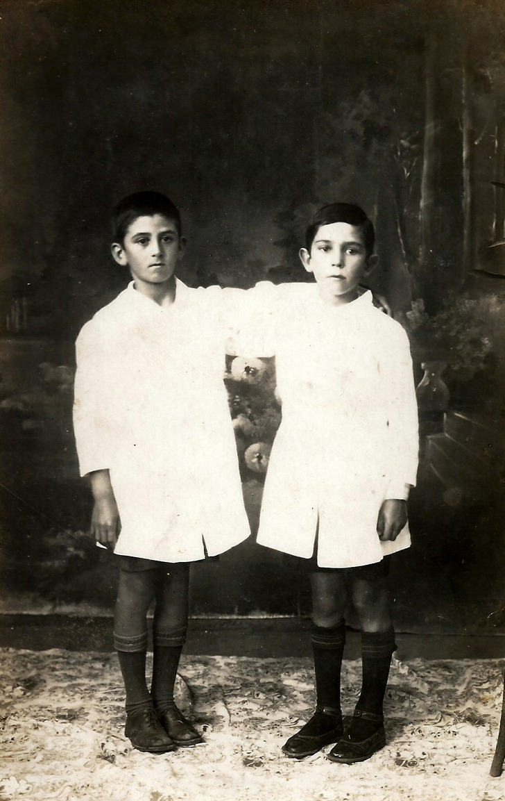 Two schoolboys in white smocks, Argentina, 1929