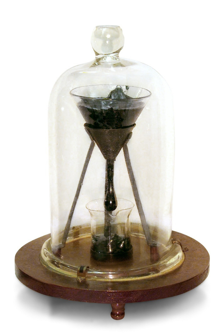 The pitch drop experiment at the University of Queensland (edited: a battery used for scale removed)