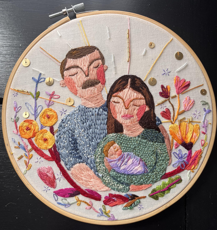 A Family Portrait With Flowers Stitched All Around It