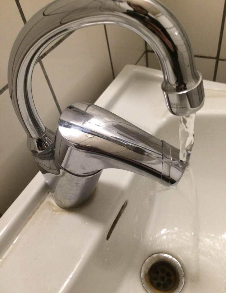 A silver bathroom faucet.